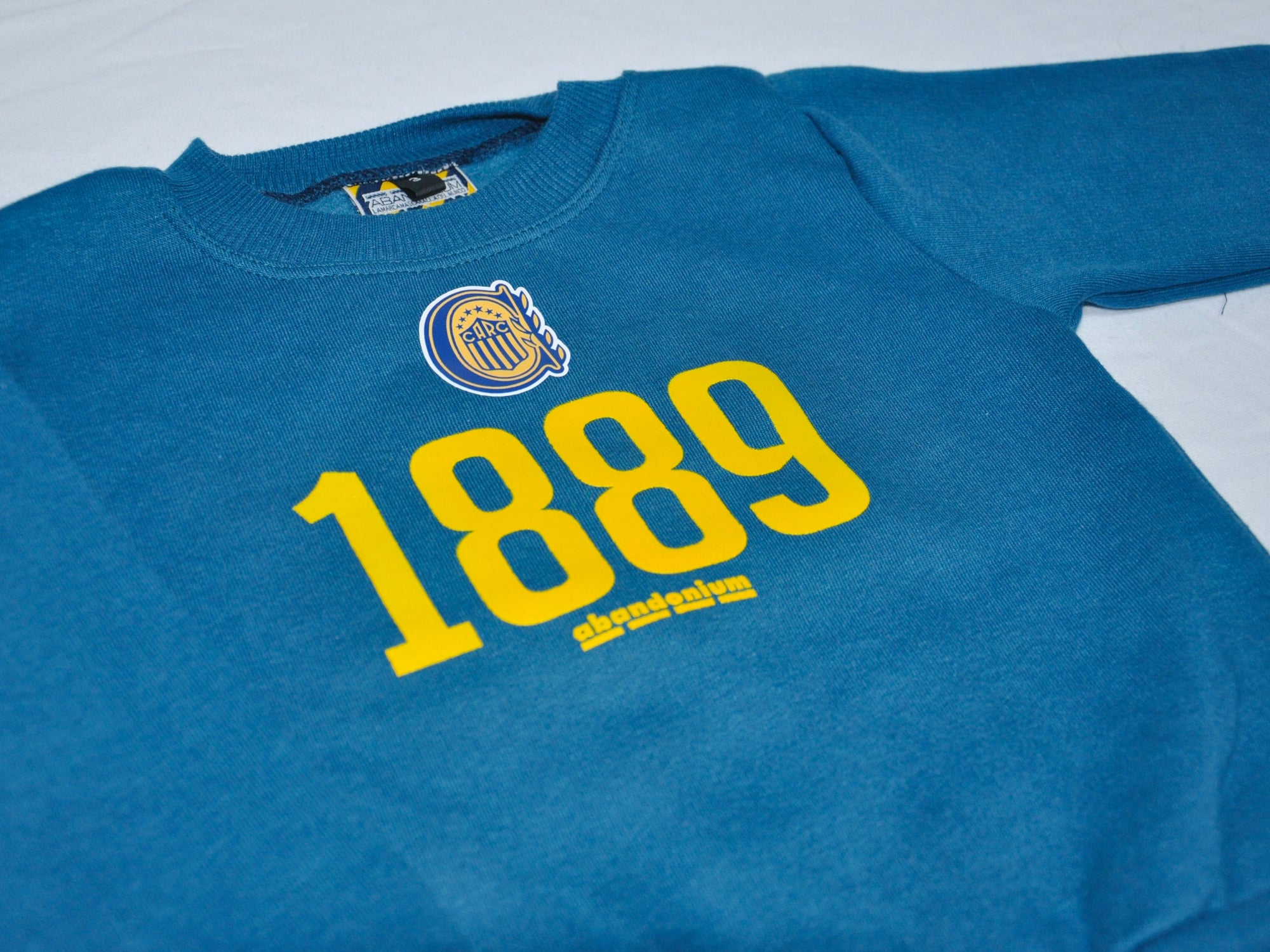 Buzo Bebé frisa 1889 Escudo