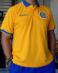Chomba Piqué Escudo Bordado
