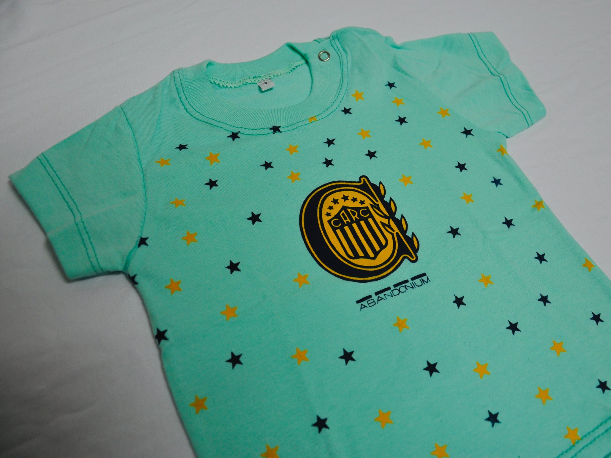 Remera MC Bebé Escudo y Estrellas